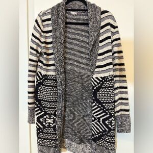 Black and white patterned cardigan.